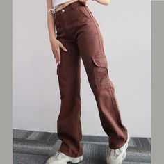 Fabricated with polyester, this garment features a secure zipper closure and a mid-rise waist. DETAILSMaterial: PolyesterClosure Type: Zipper FlyWaist Type: Mid Pants With Lots Of Pockets, Celana Kargo, Cargo Pants Streetwear, Match Three, Chique Outfit, Trousers Casual, Baggy Trousers, Lots Of Pockets, Brown Pants