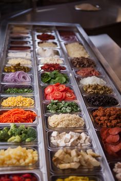 the trays are filled with different types of food