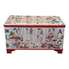 a colorful toy chest with letters and pictures on it