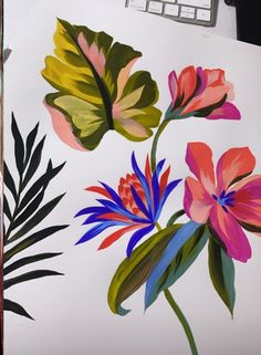 an image of flowers painted on paper with paintbrushes and watercolors in front of a computer keyboard