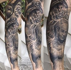 a man's arm covered in black and grey tattoos