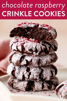 chocolate raspberry crinkle cookies stacked on top of each other