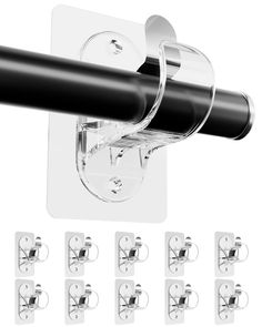 a black and white photo of a wall mounted toilet paper dispenser with eight rolls