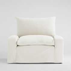 a white chair with a pillow on it