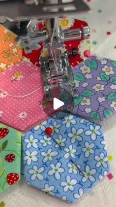 a video demonstrating how to sew with the sewing machine on top of it, including hexagons and flowers