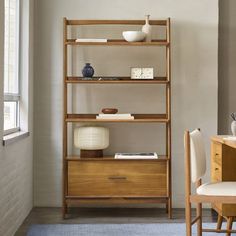 a wooden shelf sitting next to a window in a living room