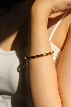 PRODUCT DESCRIPTION Golden simplicity. This piece is a minimalist statement piece for any look. The Ava Plain bangle celebrates the beauty of expert craftsmanship. Formed from polished titanium steel and coated with gleaming 18-karat gold for an opulent finish, this bangle adds a suave touch to your wrist – whether worn alone or stacked alongside your favourite timepiece. A must-have addition to your jewellery addition. Signature Gold Bangle Water Resistant 18k Gold-plated on titanium steel One Modern Matte Gold Bangle Bracelet, Classic Gold Stainless Steel Cuff Bracelet, Modern Shiny Yellow Gold Cuff Bracelet, Modern Yellow Gold Cuff Bracelet With Shiny Finish, Classic Everyday Bangle, Tarnish Resistant, Modern Gold Bangle With Polished Finish, Modern Matte Gold Bracelet For Gift, Modern Yellow Gold Bangle With Polished Finish, Modern Matte Gold Bangle