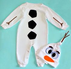 a baby's snowman outfit and hat on a blue background