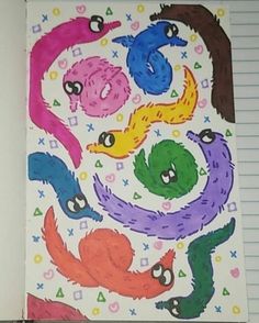 an open notebook with drawings of different colored monsters on it and lined paper in the background