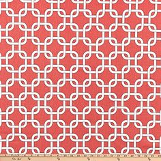 a red and white fabric with an intricate design