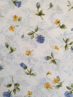 the fabric has blue and yellow flowers on it