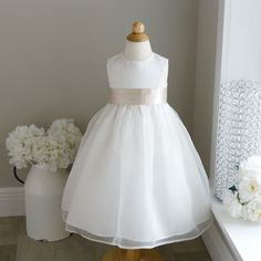 This Ivory Flower Girl Dress In Size 2t Is Breath Taking! The Sleeveless Dress Has A Luxurious Matte Satin Bodice (As In Bridal Gowns, Not Like Shiny Satin Sheets) That Zips In Back. The Flared Gathered Skirt Has An Ivory Organza Overlay. The Skirt Has Another Liner That Has A Large Crinoline Ruffle For Volume And Flare. The Luxurious Satin Sash Comes In A Champagne Hue And Is Done In A Cummerbund Style In The Front. The Back Ties Into A Long Flowing Bow For A Perfect Fit. Upper Zippered Back. G 2t Flower Girl Dress, Ivory Flower Girl Dress, Organza Overlay, Satin Flower Girl Dress, Ivory Flower Girl, Ivory Flower Girl Dresses, Satin Sheets, Ivory Flower, Hair Wreath