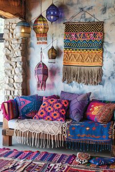 a living room filled with lots of colorful pillows