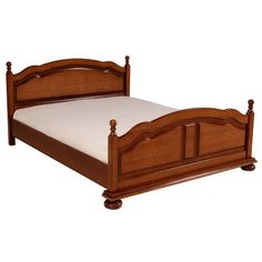 a wooden bed frame with white sheets