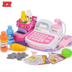 a pink toy laptop sitting on top of a table next to other toys and supplies