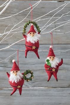 three christmas ornaments hanging from a tree