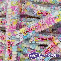 candy candies are stacked on top of each other with the words smarties written on them