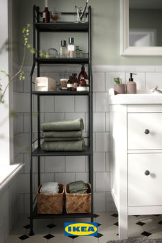 the bathroom is clean and ready to be used as a storage area for towels, soaps, and other personal care items