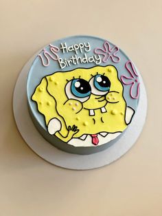 a spongebob birthday cake with the words happy birthday written on it's side