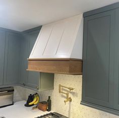 a stove top oven sitting inside of a kitchen