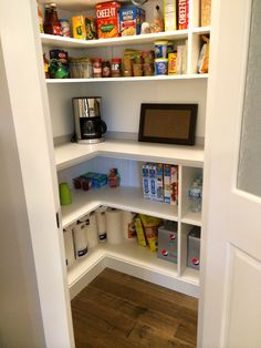 an open pantry with lots of food in it