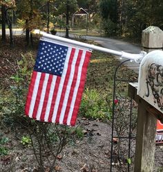 Be the first in your neighborhood to display this one-of-a-kind patriotic decorative flag set on your mailbox wood post. The 12x18 inch nylon American flag mounts on the silver 1 inch diameter brushed aluminum 2' flagpole using two flag rings that are included. Also included is a white adjustable steel mounting bracket with mounting screws and a gleaming gold acorn top. Set will mount easily on standard wood mailbox posts.The heavy duty nylon embroidered flag is double stitched, Made in the USA Mailbox Wood, Wood Mailbox, Mailbox Flag, Mailbox Posts, Mailbox Post, Wood Post, Flag Decor, Flags Of The World, Brushed Aluminum