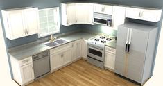 a kitchen with white cabinets and silver appliances