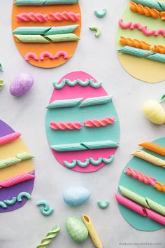 colorful paper easter eggs on a white surface