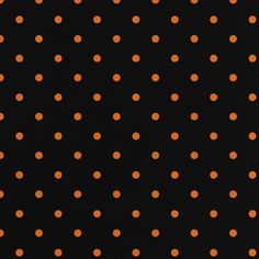 an orange polka dot pattern on black paper