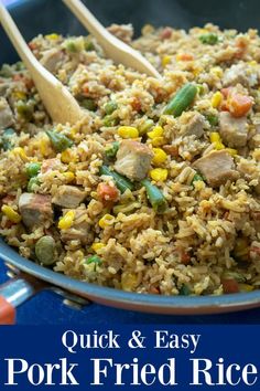 an image of fried rice with vegetables and meat in a skillet on the table