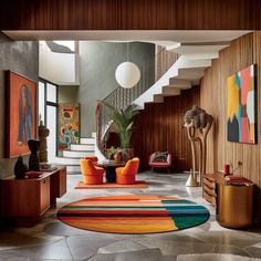 a living room filled with lots of furniture and art on the walls next to a stair case