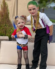 Daddy’s little monster shirt, red and blue shorts, spiked belt, studded jewelry, Harley Quinn tattoos, Harley Quinn costume, green slicked back hair, white button down shirt opened up, black slacks, joker tattoos, suicide squad movie. Kids Joker And Harley Quinn Costume, Toddler Harley Quinn Costume, Kid Joker Costume, Diy Harley Quinn Costume For Kids, Toddler Joker Costume, Super Hero Family Costumes, Harley Quinn And Joker Costume Couple, Harley Quinn And Joker Costume, Baby Harley Quinn