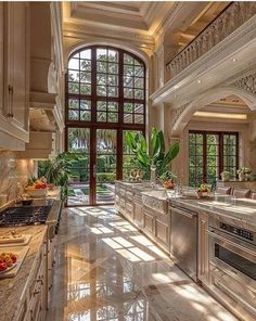 a large kitchen with marble counter tops and an island in front of the stove top oven