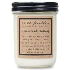 a jar of homemade holiday candles with labels on the front and bottom, sitting on a white surface