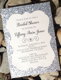 a white and silver glitter bridal shower is on top of some rocks with the words,'please join us for a bridal shower in honor of fify annie jones