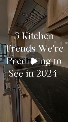 a kitchen with wooden cabinets and black counter tops in front of the words, 5 kitchen trends we're pretending to see in 2014