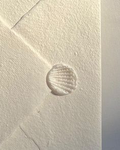 a white envelope with a shell on it