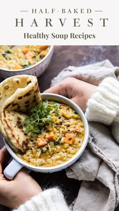 two hands holding a bowl of soup with pita bread in it and the title overlay reads half - baked harvest healthy soup recipes