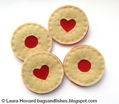 three felt circles with a heart on them