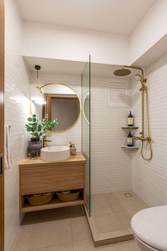 a bathroom with a shower, sink and toilet