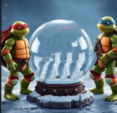 two teenaged ninja turtles standing in front of a snow globe