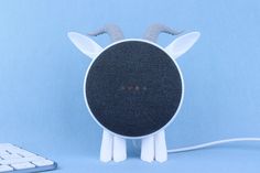 the google logo is placed on top of an echo speaker