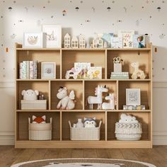 a child's playroom with toys and bookshelves on the shelves in front of it