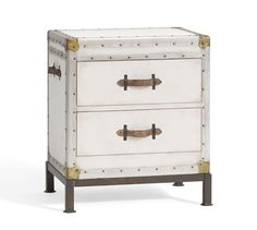 a white chest with two drawers and metal handles