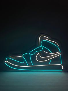 a neon nike shoe is shown in the dark