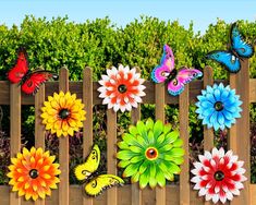 colorful flowers and butterflies on a wooden fence