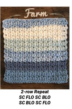 a crocheted dishcloth with the word farm written on it in white and blue