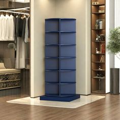 a closet with shelves and clothes hanging on the wall