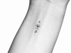 a black and white photo of a flower on the wrist