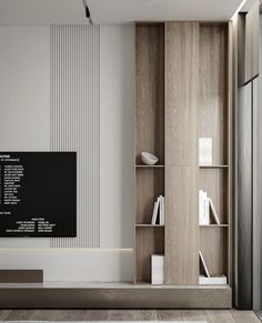 a living room filled with furniture and a flat screen tv on top of a wooden shelf